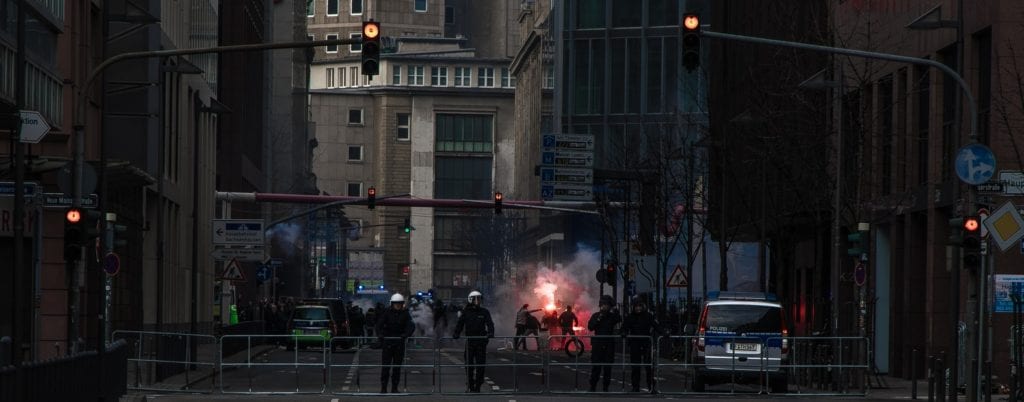 A photo of a policeman creating a barricade